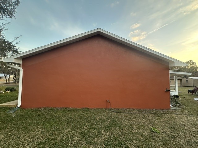 Edgewater Florida stucco exterior repaint after pressure washing and acrylic sealer