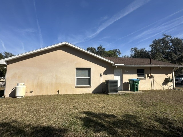 Edgewater Florida stucco home before painting rear wall